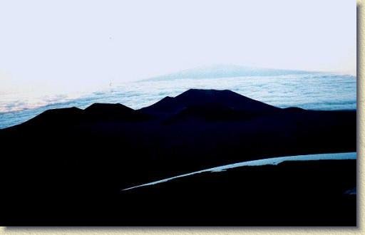 11.jpg - Sunset on Mauna Kea - you can see the mountain's shadow on top of the clouds